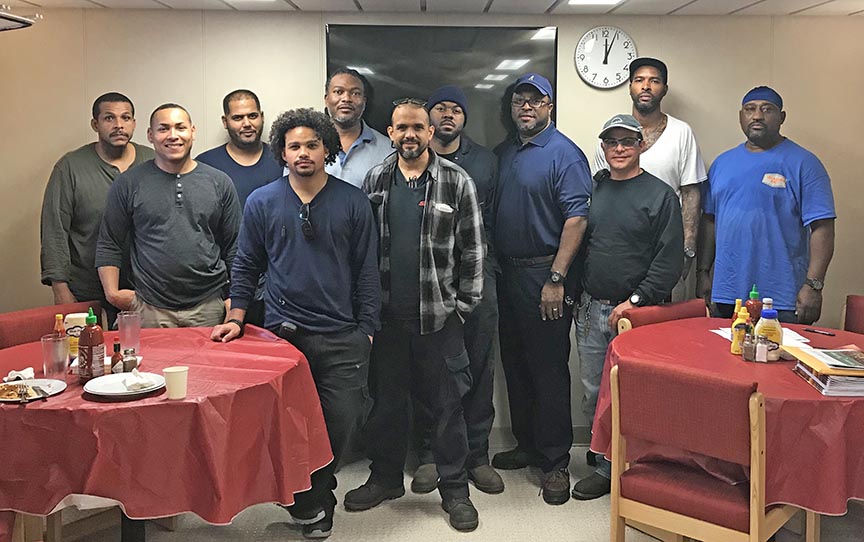 Seafarers gather with SIU Port Agent Jimmy White (fourth from right) aboard the Taíno on New Year’s Eve in Pascagoula, Mississippi.