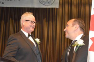 Honoree Russ Paret and the person introducing him