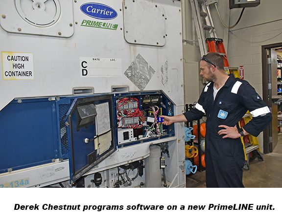 Photo of Derek Chestnut programing software on a new PrimeLINE unit.